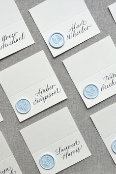 some white cards with blue ink on them