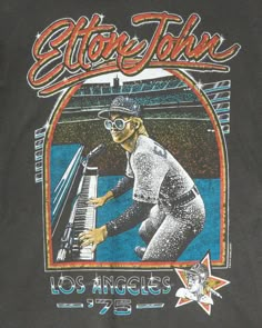 ELTON JOHN 1975 BASEBALL/PIANO TEE | Kingfisher Road | Online Boutique Vintage Tees Aesthetic, I Love Tshirt Designs, Retro Tshirt Design Graphics, Vintage Sports Tees, Elton John Fashion, Elton John Aesthetic, Band Tee Design, Bar Shirts, Artist Merch