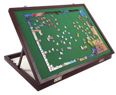 a wooden frame with puzzles in it on top of a white surface and one piece missing