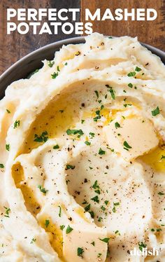 mashed potatoes in a bowl with parsley on top and text overlay that reads perfect mashed potatoes