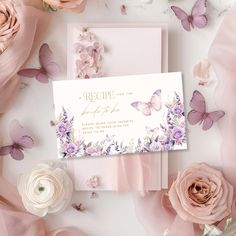 pink flowers and butterflies are scattered around the wedding stationery