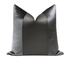 a gray pillow with two black and white stripes on the front, one in grey