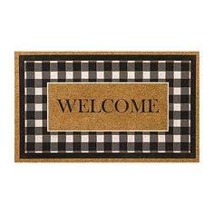 a welcome mat with the word welcome on it in black and white checkered pattern