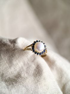 Yellow Gold Pearl Ring With Birthstone In 14k Gold, 14k Yellow Gold Pearl Ring With Birthstone, Classic Cluster Birthstone Ring, Yellow Gold 14k Pearl Ring With Birthstone, White Round Pearl Ring Stamped 14k, 14k Gold Pearl Ring With 17 Jewels, 14k Gold Pearl Ring With Prong Setting, Elegant Pearl Ring With Birthstone, Elegant Pearl Birthstone Ring