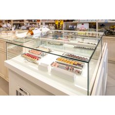 a display case filled with lots of different types of desserts