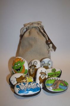 a bag full of rocks with cartoon characters painted on them