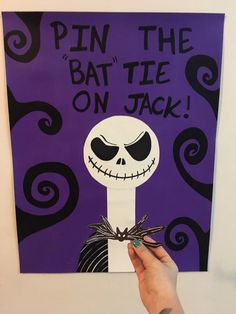 a hand holding up a piece of paper with the words pin the battie on jack