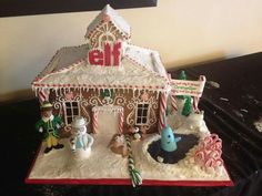 a gingerbread house is decorated with candy canes