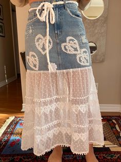 Size 26/S Maxi 35"/89cm L Model is size 4 Shabby chic, bohemian/hippy style skirt. Altered/up-cycled ripped jean skirt with polyester tulle bottom. Embellished with lace appliqués. Hand braided belt. Bohemian Cotton Denim Skirt For Summer, Bohemian Bottoms With Frayed Hem For Spring, Bohemian Spring Bottoms With Frayed Hem, Bohemian Cotton Denim Skirt For Festival, Distressed Bottoms For Spring Festival, Cotton Denim Skirt For Summer Festival, Bohemian Denim Skirt For Summer, Bohemian Skirt With Lace Trim, Bohemian Summer Denim Skirt