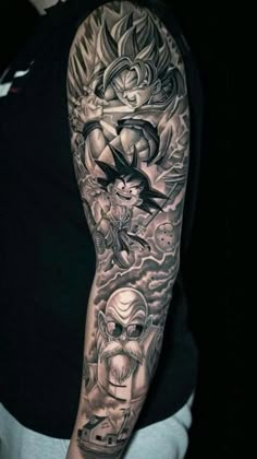 a man's arm with tattoos on it, including an image of a demon and other