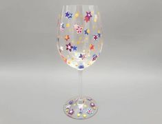 a wine glass with stars painted on it