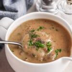 a white bowl filled with soup on top of a table