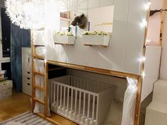 there is a bunk bed with a baby crib in the corner and lights on