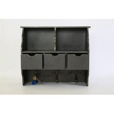 a black cabinet with three drawers and two keys