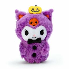 a purple stuffed animal with a pumpkin on top