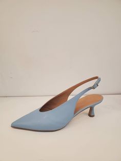 Blue Pointed Toe slingback in Faux Leather. Pulls on, 50mm covered flared heel. Beige polished sole in faux leather. Info & Care 100% PL 100% faux leather lining Handmade in Italy Size & Fit Whole sizes only, runs true to size Returns & Exchanges New and unused full-price merchandise returned 14 days after receipt is eligible for refund or exchange. Discounted merchandise is final sale. Blue Slingback Pumps With Sculpted Heel, Blue Leather Slingback Pumps With Sculpted Heel, Black Fringe Dress, Zip Front Dress, Indigo Prints, Black Satin Dress, Cowl Neck Dress, Oversized Tunic, How To Hem Pants