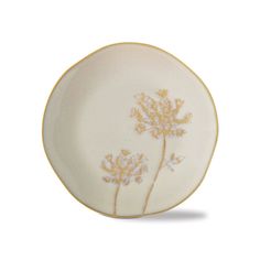 a white plate with yellow flowers painted on the side and gold trim around the edge