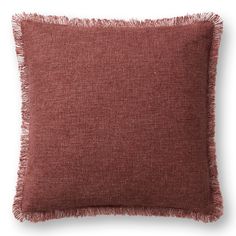 a red pillow with fringes on it