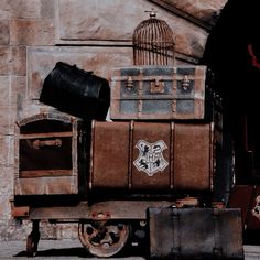 an old fashioned train cart with luggage on it