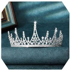 PRICES MAY VARY. Rhinstone princess tiara is made of alloy and exquisite electroplating and polishing process. Wedding crown for bride measures about 2.76 inches (7 cm) tall and 6.1 inches (15.4 cm) in diameter. Package:A crown in a box, including 2 hairpins. Prom headpiece color is silver. With the shining rhinestone, entire crown looks very beautiful and attractive. You will love it. Crystal headband is a very special gift, whether it is given to yourself or to friends around you. Quinceanera Quince Crown, Prom Headpiece, Silver Crowns, Prom Crown, Crown For Bride, Simple Crown, Prom Headband, Tiara Bride