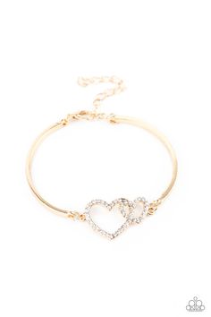 Encrusted in dainty white rhinestones, a charming pair of interlocking heart frames attach to two gold bars around the wrist, creating a flirty bangle-like bracelet. Features an adjustable clasp closure.

Sold as one individual bracelet. Paparazzi Accessories Jewelry, Gold Bars, Heart Frame, Toggle Bracelet, Paparazzi Accessories, Rhinestone Heart, Bar Bracelets, White Rhinestone, Bracelet Clasps