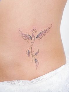 a woman's stomach with a tattoo on it