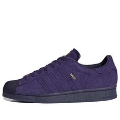 The adidas Kader Sylla x Superstar ADV 'Dark Purple' is a modern take on the classic 90s silhouette. It features a high-quality leather upper with Cader branding, signature Cadar-like cushioning, and a highly flexible rubber sole. The bold purple colorway and thick laces create a nostalgic look that is perfect for any occasion. Inspired by the iconic Superstar ADV, this sneaker is designed for comfort and style. With its timeless design and modern features, the adidas Kader Sylla x Superstar ADV 'Dark Purple' is the perfect blend of classic and contemporary. (SNKR/Skate/Unisex/Low Top/Non-Slip/Wear-resistant) Purple Adidas Shoes, Purple Adidas Superstar, Purple Adidas Sneakers, Purple Leather Adidas Sneakers, Adidas Purple Sneakers With Round Toe, Adidas Purple Sneakers For Sports, Adidas Purple Leather Sneakers, 90s Silhouette, Adidas Originals Superstar