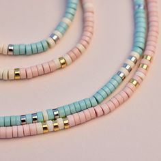 Bring alllllll the beach vibes anywhere you go with our Sealife Necklace. This beaded beauty comes in two sweet shades—a sand-inspired pink and sea-inspired turquoise—plus pops of silver or gold for a mini dose of shine. - Turquoise: brass base with rhodium plating & synthetic howlite beads- Sand: brass base with gold plating & synthetic howlite beads- Chain: 14" with 2" extension. Jump ring at 1" of extension.- Because jewelry products are handcrafted by artisans, dimensions may vary from piece Surf Necklace Pura Vida, Cheap Minimalist Beaded Necklaces For Beach, Cheap Beaded Necklaces For Beach Season, Cheap Vacation Necklaces With Heishi Beads, Cheap Adjustable Beaded Necklaces For The Beach, Affordable Beach Necklaces With Round Beads, Cheap Adjustable Necklaces For Vacation, Cheap Strand Necklaces For The Beach, Cheap Turquoise Necklace With Colorful Beads For Beach