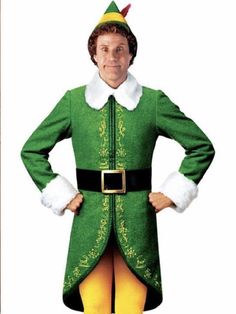 a man dressed in an elf costume standing with his hands on his hips