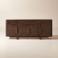 the sideboard is made out of wood and has metal handles