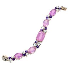 This amazing bracelet is set with the main center 24 carat natural Kunzite (20mm x 15mm) enhanced with brilliant white diamond cut natural Topaz and little natural glittering Amethysts. Set in this beautiful Sterling Silver bracelet it is 7 inches long and fits snugly and comfortably on your wrist. We have included a pair of matching earrings for free as a gift to the buyer because the earrings are not perfectly matched when sitting next to each other but look wonderful when on your ears. If you Modern Bracelets, Earrings For Sale, Diamond Cut, Bracelet Designs, Matching Earrings, White Diamond, Sterling Silver Bracelets, Pandora Charm Bracelet, Topaz