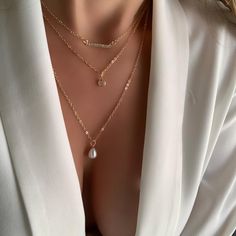 ✨ Layered necklaces are extremely on trend right now within all fashion circles and I created my collection of already layered accessories for you. Perfect for every occasion. This trendy necklace is handmade of 14K Gold Plated. ✨ This Unique set includes a chocker (16") with minimalist Cubic Zirconia pendant, a middle chain (17") with cubic zirconia gemstones charm, and bottom chain (19") with Pearl pendant. All chains attached to the one lobster claw. Adjustable length. ✨High quality materials Rose Gold Layered Clavicle Chain Necklace, Trendy Layered Necklace With Delicate Chain, Minimalist Everyday Layered Necklaces, Chic Layered Jewelry As A Gift, Minimalist Layered Jewelry For Gift, Chic Layered Jewelry For Gifts, Minimalist Layered Jewelry Gift, Minimalist Layered Everyday Jewelry, Minimalist Layered Charm Necklaces