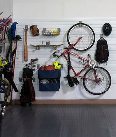 a bike hanging on the wall in a garage