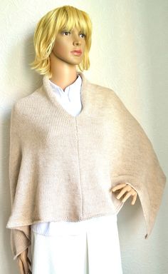 Beige women's poncho handmade from soft and light lana wool yarn. Warm and cosy. This long poncho will warm you up in chilly evening. Edge facings accurately decorated by hand with crochet hook. Accurately knitted from high quality yarns, so, poncho is durable and easy to maintain. Also it's available hand knitted works according to your model and size. Size: universal, length 50'' (128cm), width 25'' (64cm). Fiber: lana wool - acrylic yarns. Care: hand wash at 30 degrees C. - lay flat to dry. Beige Alpaca Poncho One Size, Beige Alpaca Poncho For Winter, Beige Alpaca One-size Poncho, One Size Beige Alpaca Poncho, Beige Crochet Poncho For Fall, Winter Beige Alpaca Poncho, Fall Crochet Beige Poncho, Hand Knitted Beige Shawl For Winter, Hand Knitted Beige Winter Shawl