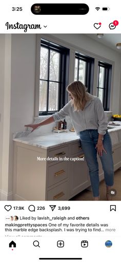 a woman standing on top of a kitchen counter next to a sink and window with the caption instagram