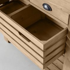 a wooden dresser with two drawers and one drawer open