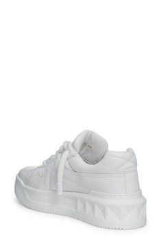 A single Maxi stud marks the intersection of quilting seams on this Italian sneaker featuring a whiteout design. Lace-up style Leather upper and lining/rubber sole Made in Italy Men's Designer Shoes Italian Sneakers, Mens Designer Shoes, Up Styles, Valentino Garavani, Low Top, Designer Shoes, Top Sneakers, Rubber Sole, Leather Upper