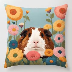 a brown and white guinea pig surrounded by flowers