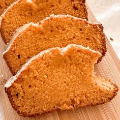 slices of cake sitting on top of a wooden cutting board