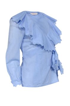 Elevate your boho chic game with Tory Burch's blue wrap tie top. Made from 100% cotton, this playful top features a ruffle neckline and frayed hem for a touch of flair. Pair with crop jeans and espadrille sandals for a stylish, laid-back look. Size S 100% Cotton Unlined Wrap tie closure Ruffled hem Frayed trim Bust 34" Waist 26" Shoulder to hem 23" Sleeve length 21" Light Blue Cotton Blouse With Ruffles, Espadrille Sandals, Crop Jeans, Tie Top, Cotton Top, New Trends, Cotton Tops, Ruffle Hem, Signature Style