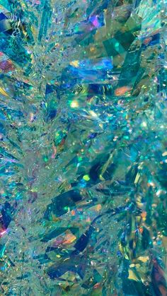 an abstract image of blue, green and yellow colors with lots of bubbles in the water