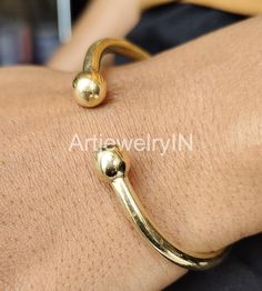 Brass Bangle, 14K Gold Plated Bangles, Adjustable Ball Bangle, Indian Bangle, Brass Bangle, Bangle For Women. Solid Brass Bangle Handmade item Materials: Brass Adjustable : Yes Style: Bangle Bracelet Size Inches Circumference/Diameter 7 / 2.23 7.5 / 2.39 8 / 2.55 8.5 / 2.71 9 / 2.87 9.5 / 3 Elegant, , minimal and shiny ! A lovely basic to have in your wardrobe and wear anytime  O T H E R ∙ I N F O R M A T I O N * All items are nicely packaged ready to gift in elegant jewelry boxes. Please store Gold Bangle Bracelet With Simple Design, Gold Simple Design Bangle Bracelet, Brass Bangle, Gold Plated Bangles, Bangles Indian, The Bangles, Handmade Bangles, Jewelry Boxes, Elegant Jewelry