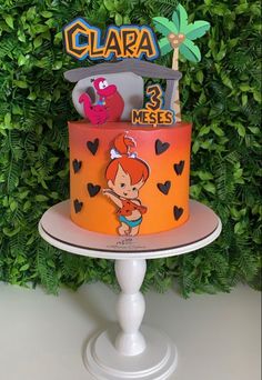 there is a cake that has been decorated with cartoon characters