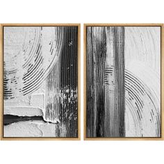 two black and white paintings with wood grains on the wall in front of them