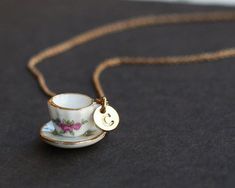 Tea cup necklace, personalized initial necklace, tiny pink tea cup set, cooking party jewelry, coffee cup necklace, bridesmaids jewelryGood gift for her. Each of them is unique, has its own meaning.----14K GOLD Plated chains----tea cup set charm----14K GOLD Plated initial disc----Chain length is 45cm. (if you want other length, please contact me, it is free between 30cm to 60cm) Tea Cup Necklace, Tea Cup Jewelry, Tea Jewelry, Cooking Party, Pink Tea Cups, Teapots Unique, Bridesmaids Jewelry, Pink Tea, Best Gifts For Her