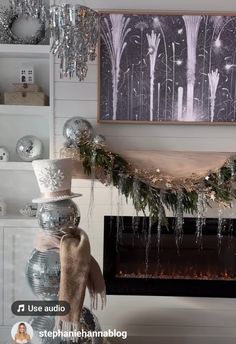 a fireplace decorated for christmas with silver and white decorations