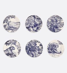 six blue and white plates with animals on them