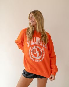 Get ready to show off your team spirit with the "Athletic Dept" Sweatshirt. Perfect for fans of Oklahoma State, this sweatshirt is not only stylish, but also incredibly cute. Whether you're heading to the big game or cheering from the couch, this sweatshirt will keep you warm and fashionable. Go Cowboys! Color: Orange Fabric: 50% Cotton 50% Polyester Style #: MADLEYATHSWEAT Go Cowboys, Lace Trim Cami Top, Mini Tube Dress, Open Back Maxi Dress, Lace Trim Cami, Oklahoma State, Cute Sweatshirts, Orange Fabric, Big Game