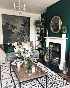 a living room filled with furniture and a fire place in front of a painting on the wall