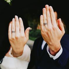 two people are holding their hands up with the word hope written on them in small letters